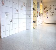 Hospital lobby room floor shines brightly with top coat solvent resisting application.