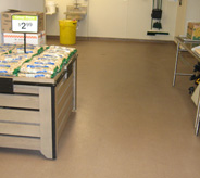 Display stand with product on top of supermarket flooring