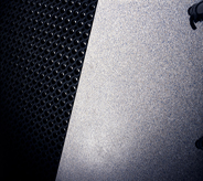 Black rubber mat rests atop grey colored floor coverings for trailer protection.