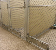 Pet holding pens with resistant veterinary flooring.