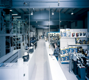 Equipment is spread out over the vast warehouse floor.